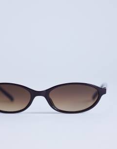 Model wearing Lanzarote oval sunglasses in burgundy