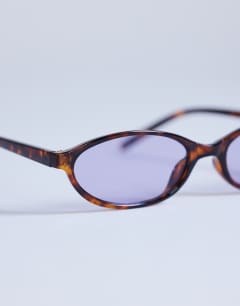 Model wearing Lanzarote oval sunglasses in tortoise