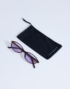 Model wearing Lanzarote oval sunglasses in tortoise