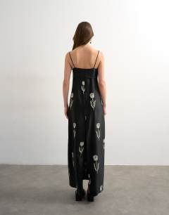 Model wearing Lapel bust maxi dress with embroidered flowers in black