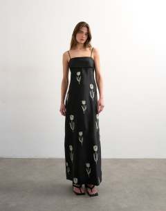 Model wearing Lapel bust maxi dress with embroidered flowers in black