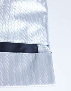 Model wearing Lara weave oversized clutch bag in silver