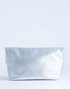 Model wearing Lara weave oversized clutch bag in silver