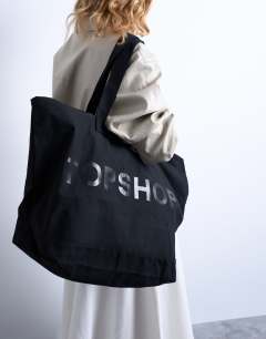 Model wearing Large canvas tote bag in black