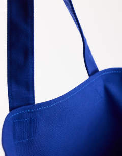 Model wearing Large canvas tote bag in cobalt