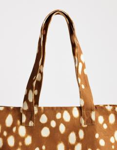 Model wearing Large canvas tote in deer print
