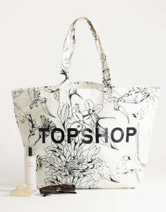 Model wearing Large printed canvas tote bag in floral