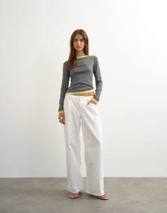 Model wearing Layered long sleeve fitted tee in grey and green