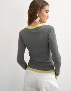 Model wearing Layered long sleeve fitted tee in grey and green