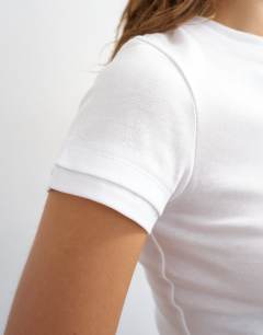 Model wearing Layered short sleeve fitted tee in white