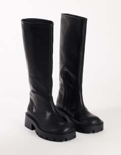 Model wearing Lennox chunky knee high boot in black