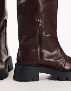 Model wearing Lennox chunky knee high boot in chocolate