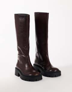 Model wearing Lennox chunky knee high boot in chocolate