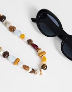 Model wearing Leo semi precious beaded necklace in pearl multi