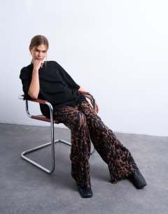 Model wearing Leopard print crinkle wide leg trouser in brown