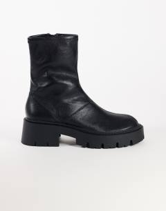 Model wearing Liam chunky sock boot in black