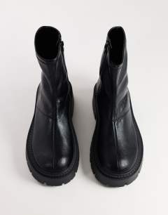 Model wearing Liam chunky sock boot in black