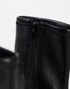 Model wearing Liam chunky sock boot in black