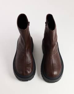 Model wearing Liam chunky sock boot in chocolate