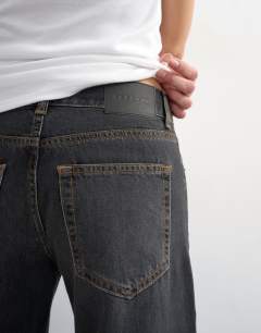 Model wearing Light weight wide crop jean in washed black