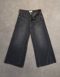 Model wearing Light weight wide crop jean in washed black