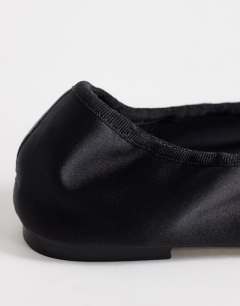 Model wearing Lila round toe ballet flat in black satin