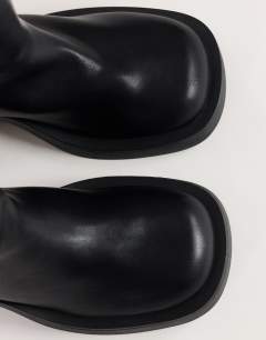 Model wearing Lillian chunky ankle boot in black