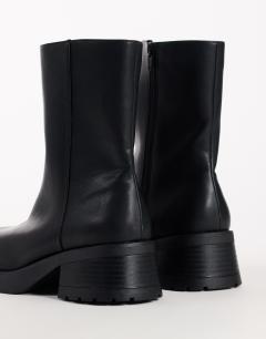 Model wearing Lillian chunky ankle boot in black