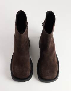 Model wearing Lillian real suede chunky ankle boot in chocolate