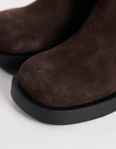 Model wearing Lillian real suede chunky ankle boot in chocolate