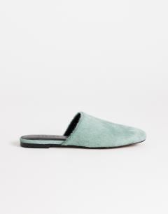 Model wearing Lillie real hair on leather round toe flat shoe in aqua