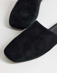 Model wearing Lillie real suede round toe flat shoe in black