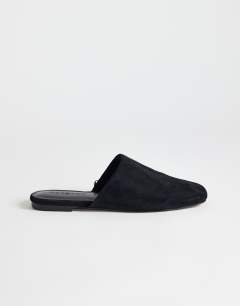 Model wearing Lillie real suede round toe flat shoe in black