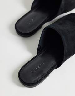 Model wearing Lillie real suede round toe flat shoe in black