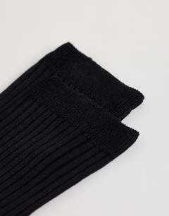 Model wearing Lillie ribbed socks in black