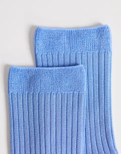 Model wearing Lillie ribbed socks in blue