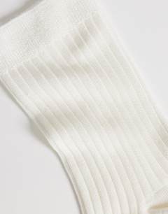 Model wearing Lillie ribbed socks in off white
