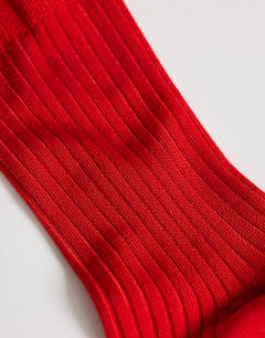 Model wearing Lillie ribbed socks in red