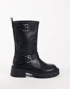 Model wearing Lincon chunky mid calf boot with buckles in black