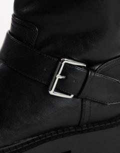 Model wearing Lincon chunky mid calf boot with buckles in black
