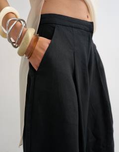 Model wearing Linen A line culotte  in black