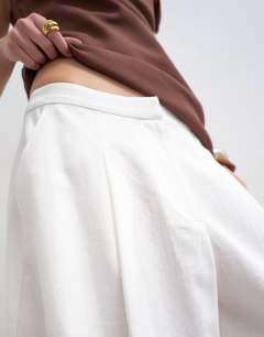 Model wearing Linen A line culotte in white