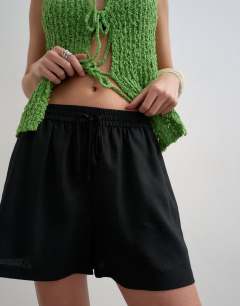 Model wearing Linen A line short in black