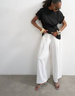 Model wearing Linen A line wide leg trouser in white