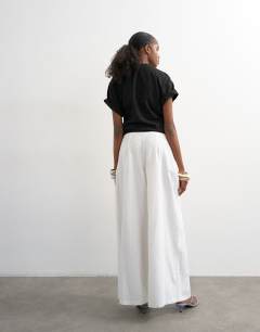 Model wearing Linen A line wide leg trouser in white