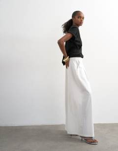 Model wearing Linen A line wide leg trouser in white
