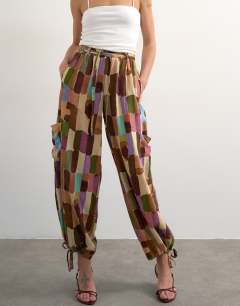 Model wearing Linen abstract print cargo in brown