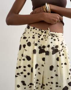 Model wearing Linen balloon trouser with tie waist in cow print