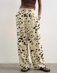 Model wearing Linen balloon trouser with tie waist in cow print