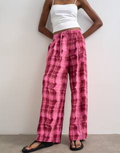 Model wearing Linen balloon trouser with tie waist in pink check